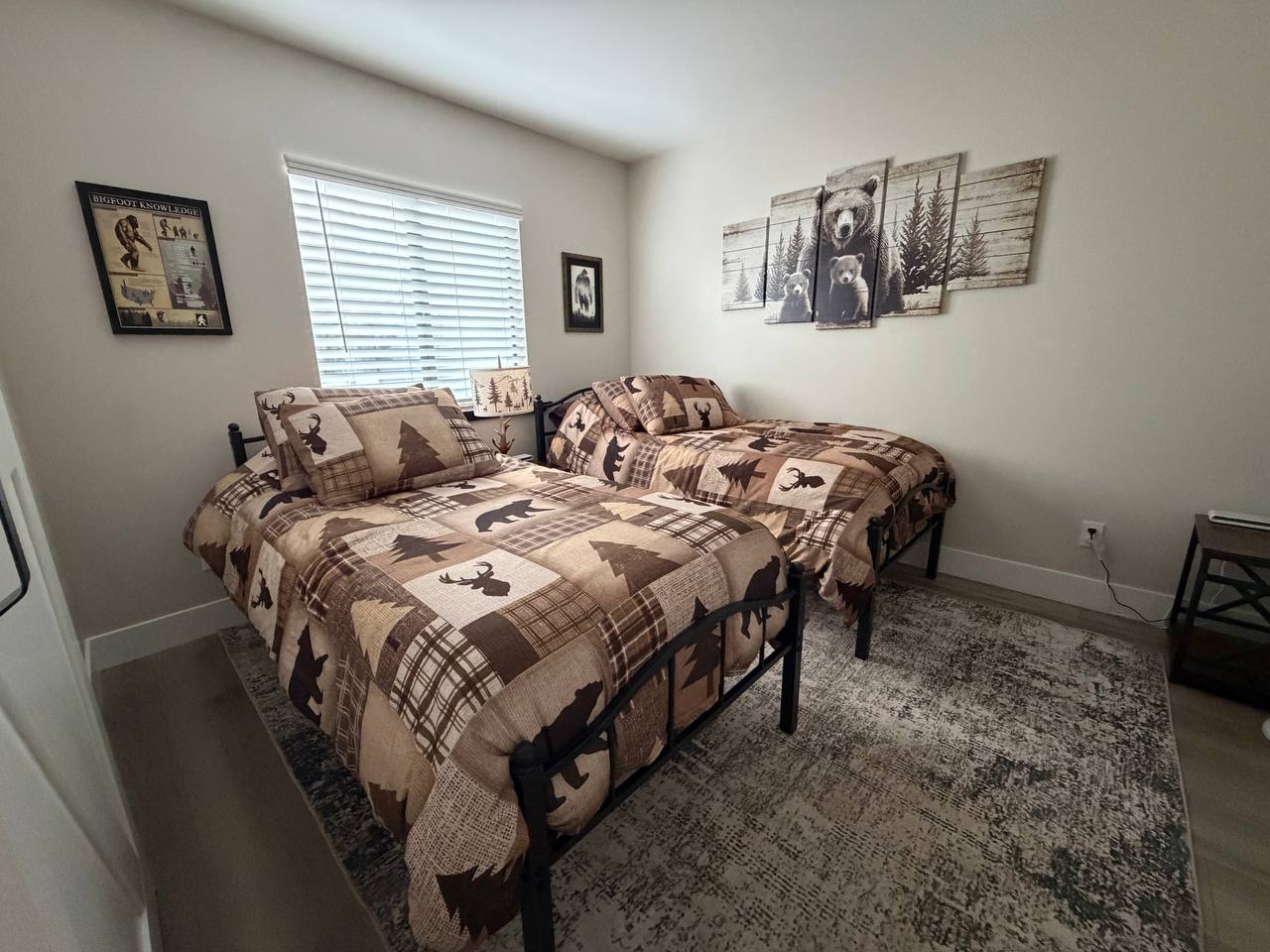 Twin bedroom with wildlife art