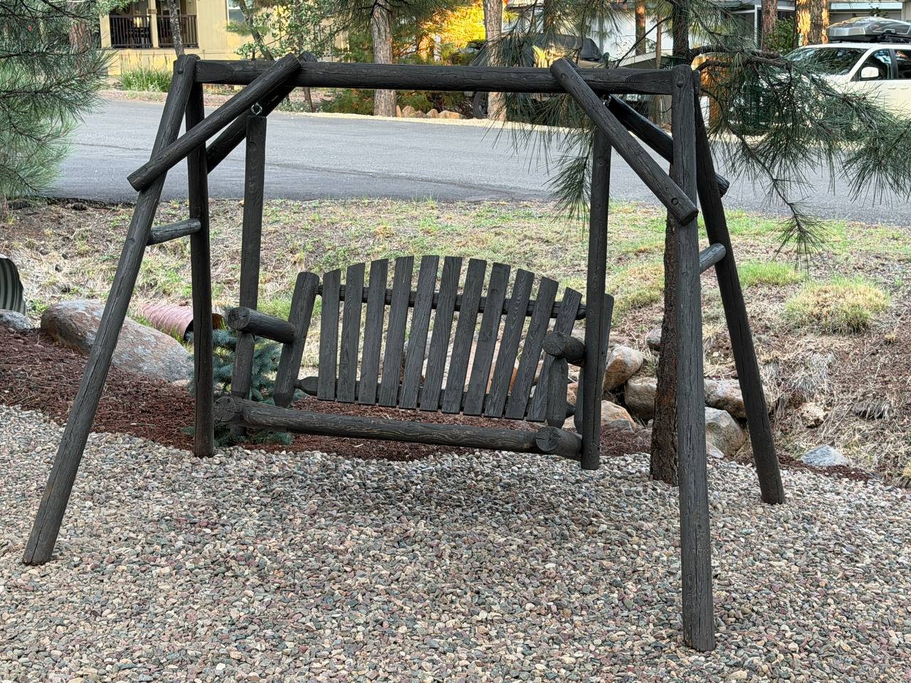 Rustic log porch swing